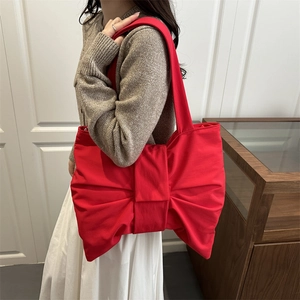 Chic red nylon shoulder bag with a large decorative bow for women daily casual style