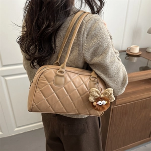 Chic light brown quilted shoulder bag with a cute plush bow pendant for stylish women