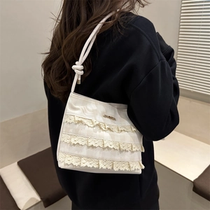 2025 Summer minimalist white lace ruffled bucket bag with metallic logo and knot strap