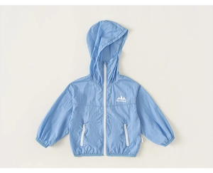 Close-up of kids' light blue hooded windbreaker jacket with white zip pockets and logo