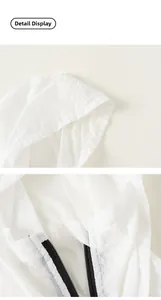 Close-up of white hooded sun protection jacket showing zipper and lightweight texture