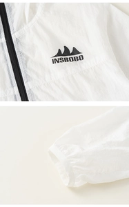 Detailed macro view of white sun protection jacket with INSBOBO logo and elastic cuffs
