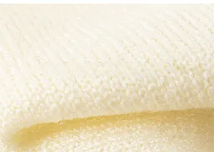 Close-up detail of soft ribbed knit texture and premium fabric for children's sweater vest