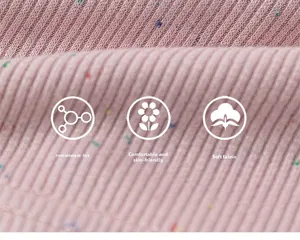 Close-up of soft pink ribbed knit fabric with colorful specks and high elasticity