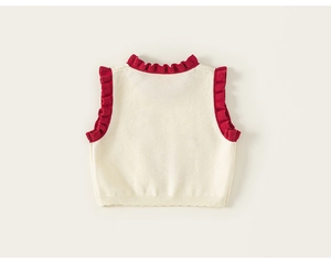 Detailed back view of a cream knit vest featuring red ruffle trim and wavy hem edges
