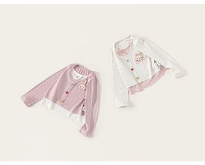Detail of baby fake two-piece knit cardigans with rainbow buttons and cute rabbit patch