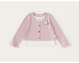 Detail of pink ribbed girl's top featuring colorful buttons and cute rabbit embroidery