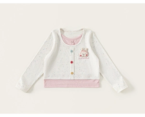 Detail view of girls' faux two-piece long sleeve top with bunny patch and colored buttons