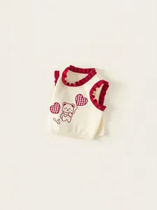 Children's knitted beige vest with red wavy trim and cartoon bear graphic print