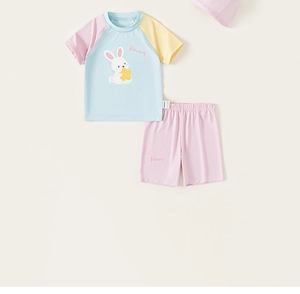 Flat lay of a 3-piece kids swimwear set with bunny print and light blue color block design