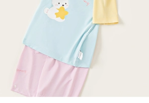 Detail of light blue kids summer pajama set with bunny print and contrast color sleeves