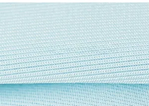 Close-up detail of soft light blue knitted cotton fabric texture for children's clothing