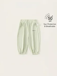 Pantalon de protection solaire enfant vert menthe UPF 50+ en tissu respirant
