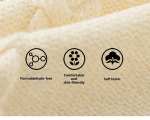 Macro shot of warm beige soft knit fabric showing premium texture and soft skin-friendly fibers