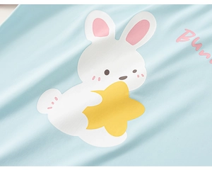 Close-up of cute cartoon bunny and Bunny text on soft light blue children's fabric