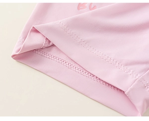 Detail shot showing high-quality double-stitch hem on soft pink cotton kids wear
