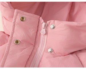 Close-up of pink windproof puffer jacket featuring durable resin zipper and metal snaps