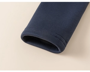 Detail of navy blue hoodie cuffs showing premium knit fabric and double-needle stitching