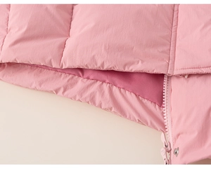 Close-up of pink hooded puffer jacket showing high-quality zipper and snap button details