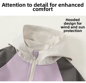 Detail of hooded jacket collar showing windproof design and patchwork colors