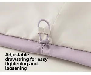 Detail view of girls' light purple color-block jacket with adjustable elastic drawstring hem