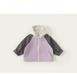 Detailed flat lay of kids hooded jacket with color-block purple and grey panels