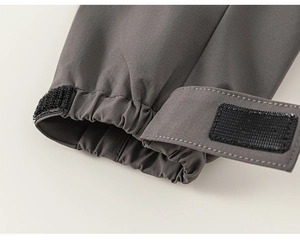 Detail shot of girls outdoor jacket sleeve with adjustable velcro cuff and ripstop fabric