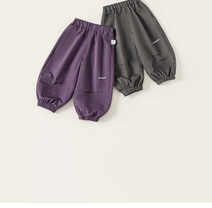 Flat lay of purple and dark grey cargo jogger pants for boys with elastic cuffs