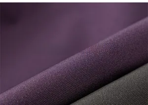 Close-up of durable high-density fabric texture for boys cargo pants in dark green