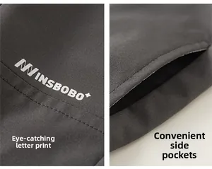 Detailed view of kids cargo pants showing letter prints and functional side pockets