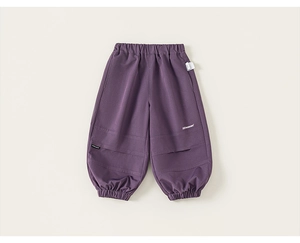 Detail view of purple boys cargo pants featuring elastic waistband and brand logo