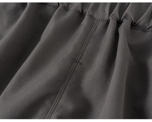 Detailed view of high-density woven fabric with elastic waistband and double-needle stitching