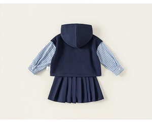 Detail view of the pleated skirt and hooded vest back from the girls academy style set
