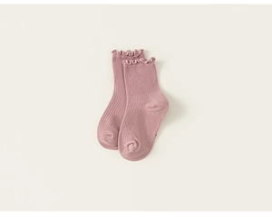 Detailed macro view of girls' dusty rose mesh socks with ruffles and ribbed knit texture