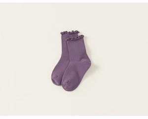 Detail of dark purple ribbed mesh socks for girls with decorative ruffled cuffs texture