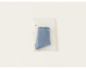 Blue cotton socks with ruffled edges packaged in a frosted zipper bag with insbobo logo