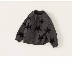 Detail of dark grey knit cardigan for boys featuring black star patterns and zipper