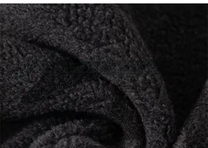 Macro view of black fleece fabric detail showing soft texture and thermal material
