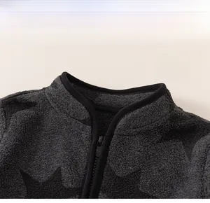 Detail of classic stand collar and zipper on grey fleece jacket with star patterns