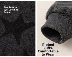 Detailed macro view of star print and ribbed cuffs on kids dark grey fleece jacket
