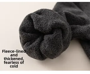 Detailed macro view of the thick warm fleece lining in dark grey toddler knitwear
