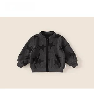 Detail view of boys' warm fleece jacket with full-print stars and metal zipper closure