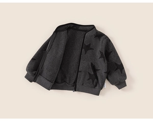 Detail of grey fleece cardigan with black star prints and rib-knit cuffs for kids