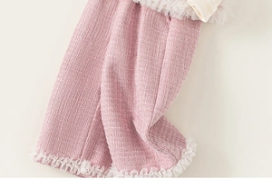 Detail view of pink tweed fabric featuring delicate white double-layer pleated lace trim