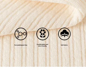 Detail of soft off-white rib knit fabric showing breathable and skin-friendly texture