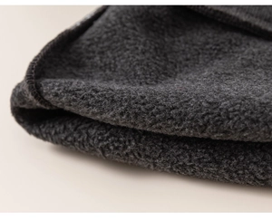 Close-up detail of thickened charcoal grey fleece lining with high-density lock-stitch edging