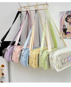 Detail view of colorful nylon crossbody bags with transparent mesh pockets and cute badges