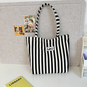Vertical blue and white striped canvas tote bag with Leo logo and large capacity handles