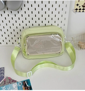 Light green nylon crossbody bag with transparent zip pocket and adjustable strap