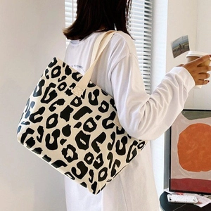 Canvas leopard print tote bag with durable white straps for women commute and casual use